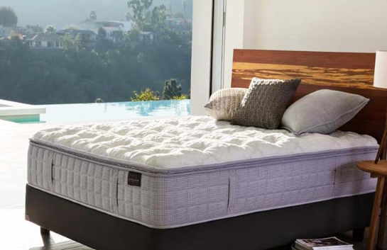 White Aireloom Mattress on a wooden bed
